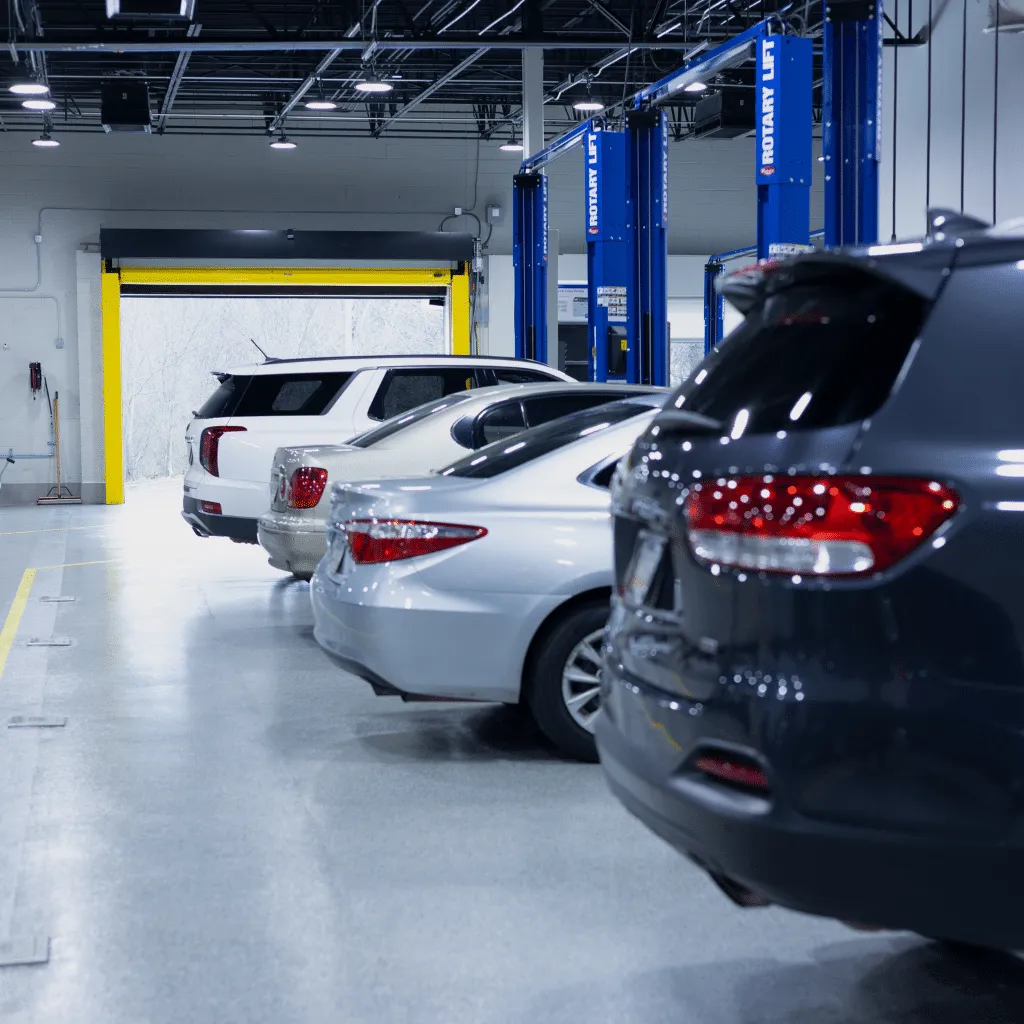 four vehicles getting auto repair service