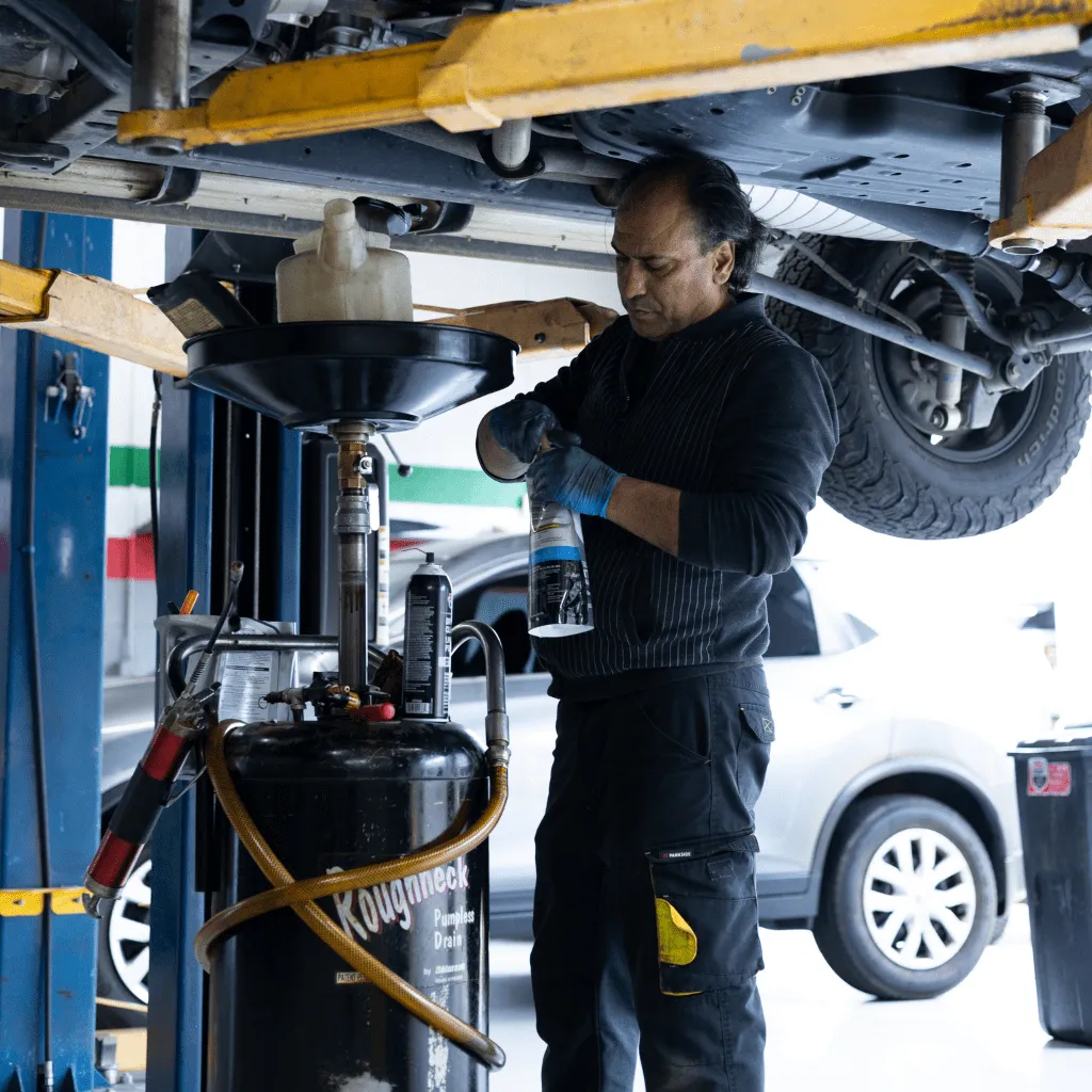 mechanic actively opening or closing an auto repair product